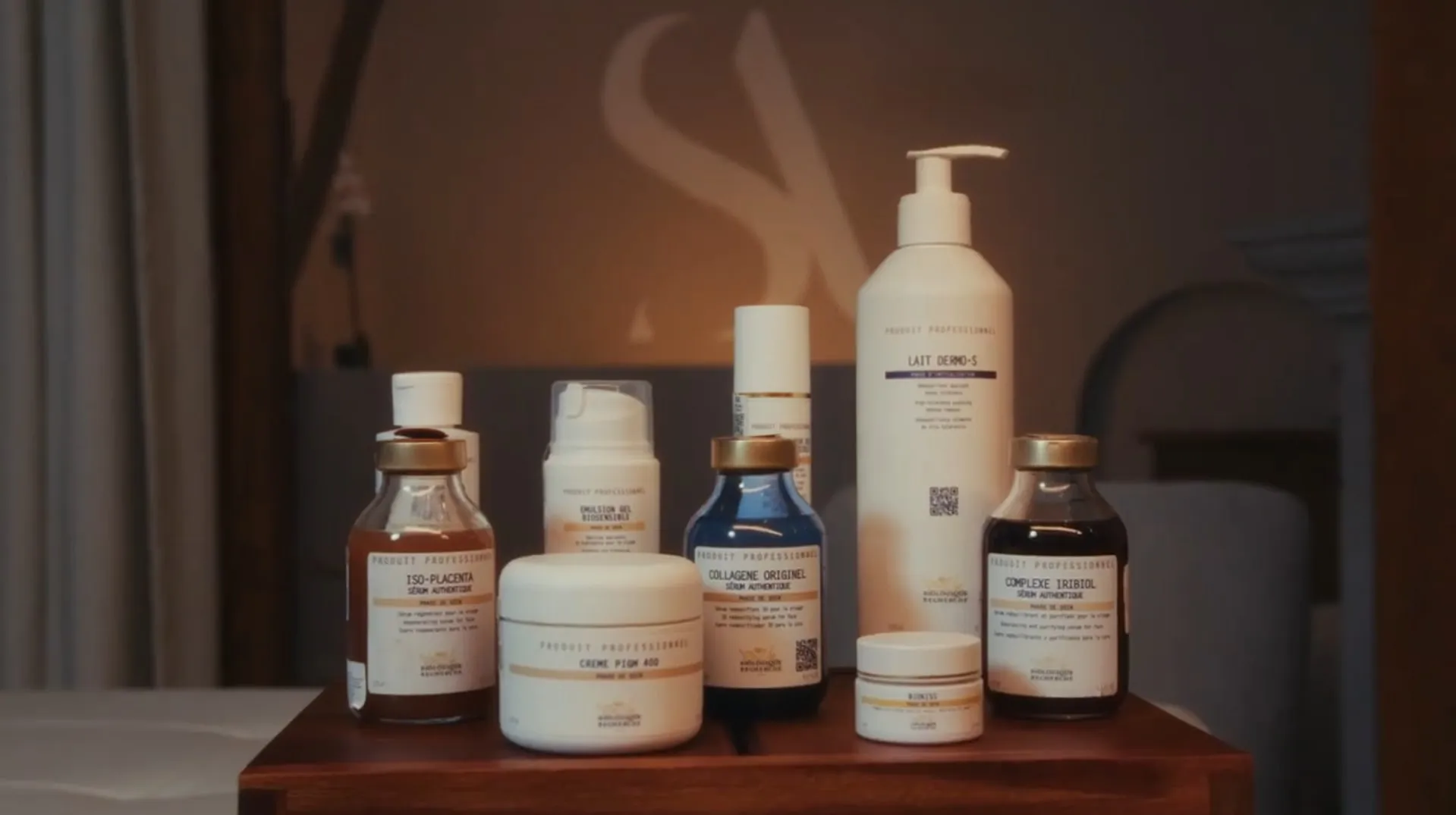 Biologique Recherche products on a wooden table, the Santina monogram lit behind